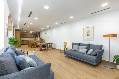 a living room with two couches and a table at Residencia Demar in Godella