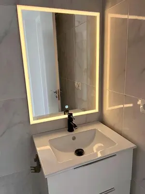 a bathroom with a white sink and a mirror at Alojamiento en Losa del Obispo in Losa del Obispo