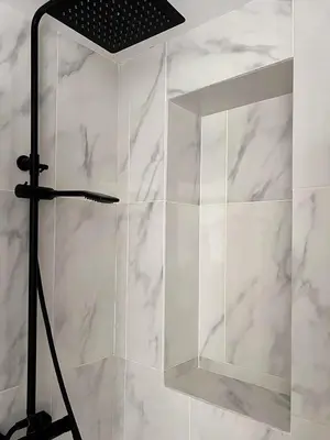 a shower with a glass door in a bathroom at Alojamiento en Losa del Obispo in Losa del Obispo