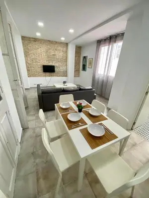 a living room with a couch and a table at Ruzafa Vibes Apartments in Valencia
