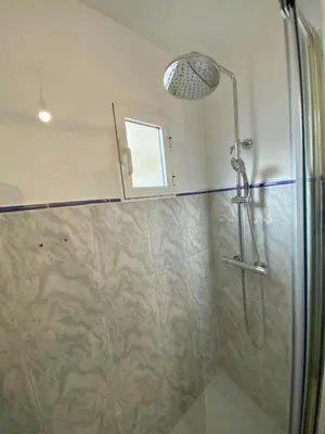 a bathroom with a sink and a toilet and a mirror at Ruzafa Vibes Apartments in Valencia