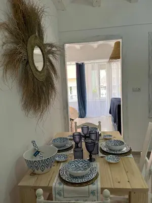 a dining room table with blue and white dishes on it at Alzira bonita Loft C junto plaza mayor, Les Muralles in Alzira