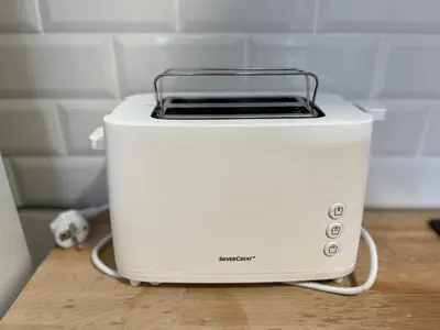 a white toaster sitting on top of a counter at Alzira bonita Ático E Plaza Mayor con gran terraza in Alzira