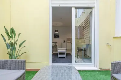 an open door to a patio with a table and chairs at Sunny,Private Terrace,Wheelchair access in Valencia