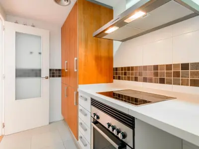 a kitchen with white counters and a stove top oven at Apartment Porte Venere by Interhome in Moncófar