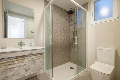 a bathroom with a shower and a toilet and a sink at Apartment With Super Comfortable Beds in Valencia