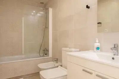 a bathroom with a toilet and a sink and a shower at Apartment With Super Comfortable Beds in Valencia