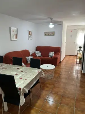 a living room with a couch and a table at Apartamento Casa Quiles in Losa del Obispo