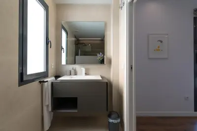 a bathroom with a sink and a mirror at Casa Rural Espadan Suites in Artana
