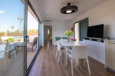 a kitchen and dining room with a table and chairs at Casa Rural Espadan Suites in Artana