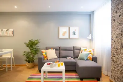 a living room with a couch and a table at SingularStays Baleares in Valencia