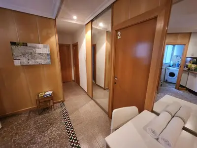 a bedroom with a large bed and a television at eXperience Rooms Valencia in Valencia