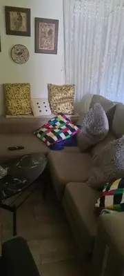 a couch with pillows on it in a living room at VALENCIA in Valencia