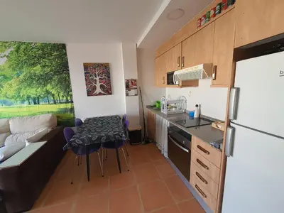 a kitchen and living room with a couch and a table at Apartamento Almenara Nova Almenareta in Almenara