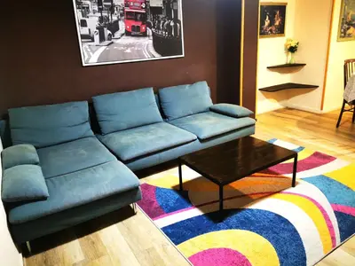 a living room with a blue couch and a coffee table at Apartamento a 5 minutos distancia de playa en Puerto de Sagunto -Full Apartment -120m2 in Puerto de Sagunto
