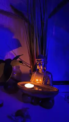 a vase sitting on a table with a candle at BLUE DOUBLE PRIVATE ROOM AT FRONT BEACH - HABITACION en la playa piso compartido in Valencia