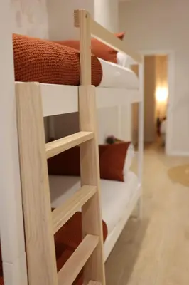 a group of bunk beds in a room at FLORIT FLATS - The Maritim Serreria Suites in Valencia