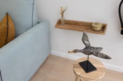 a figurine of a bird on a table in a room at FLORIT FLATS - The Maritim Serreria Suites in Valencia