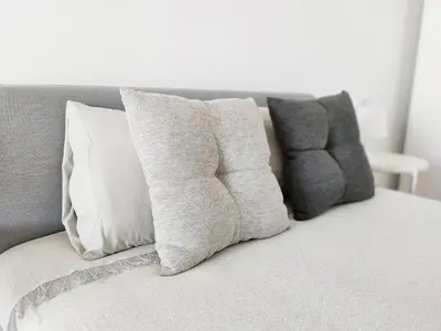 a group of pillows sitting on top of a couch at Global Vacacional, Moderno apartamento con terraza y vistas al mar in Canet de Berenguer