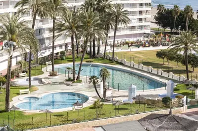 an overhead view of a pool with palm trees and a building at Florazar 1, II-A 11-B in Cullera