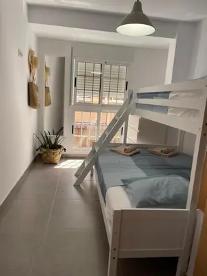 a bedroom with a bunk bed and a window at UIM Mediterraneo Libertad 1 Wifi in Puerto de Sagunto