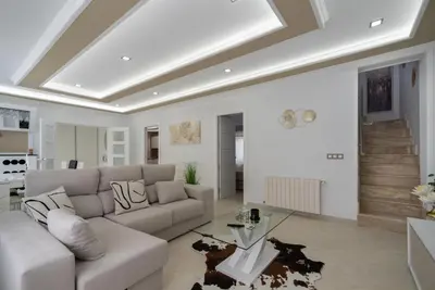 a living room with a couch and a table at DREAM HOUSE in Burriana
