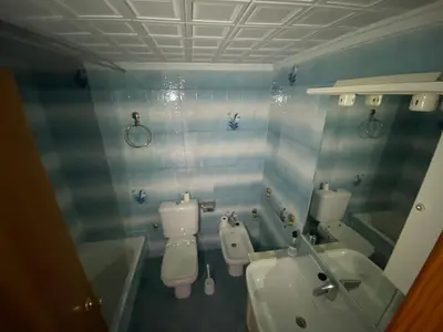 a bathroom with a toilet and a sink at Florazar 2 Cullera in Cullera