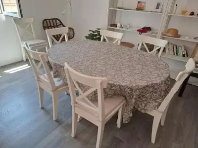 a dining room table and chairs with a table and a table and chairs at 120 sqm Loft-style Apartment Beach Royal Marina in Valencia