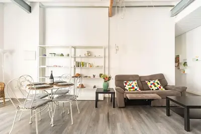 a living room with a couch and a table at 120 sqm Loft-style Apartment Beach Royal Marina in Valencia