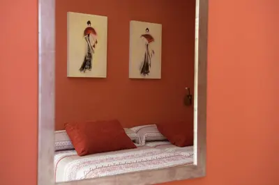 a mirror reflection of a bed in a room at Casa Lucía in Requena