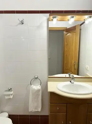 a bathroom with a sink and a mirror at Apartamentos La Muela - Chulilla in Chulilla