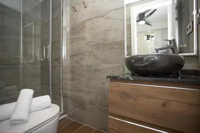 a bathroom with a black sink and a mirror at SingularStays Xativa III in Valencia