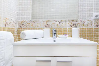 a bathroom with a white sink and a mirror at Cabanyal Luxury Malvarrosa Beach in Valencia