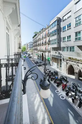 a group of motorcycles parked on a city street at Center City Flats in Valencia