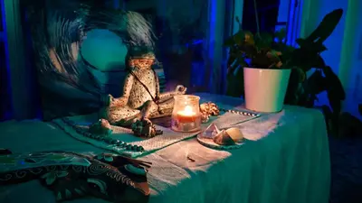 a table with a figurine and a candle on it at SUNSET ROOM AT FRONT BEACH - HABITACION EN LA PLAYA en Piso compartido in Tavernes de Valldigna