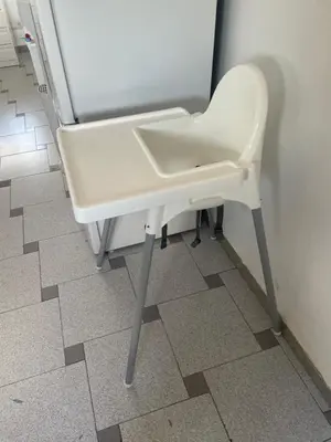 a white chair sitting in front of a refrigerator at Attic Loft Gran Vía in Valencia