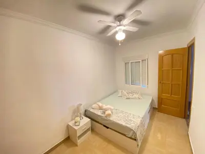 a bedroom with a bed and a ceiling fan at Almudafer in Puerto de Sagunto
