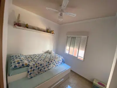a small bedroom with a bed and a window at Almudafer in Puerto de Sagunto