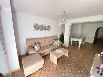 a living room with a couch and a table at Almudafer in Puerto de Sagunto