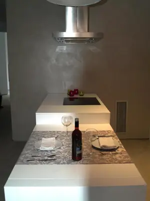a counter with a bottle of wine and glasses on it at El 16 Ruzafa in Valencia