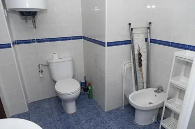 a bathroom with a toilet and a sink at Saint Germain, A-2-4 in Cullera