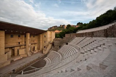 an amphitheater in aniseum with a castle in the background at Casa cerca de la playa con patio y garaje privado in Puerto de Sagunto