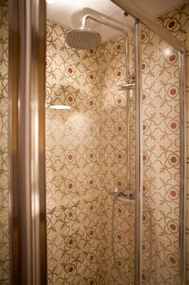 a shower in a bathroom with a wall at Authentic Charming Apartment/Wifi/Air Conditioning in Valencia