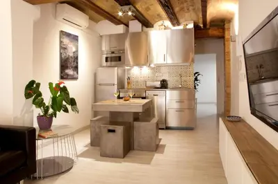 a kitchen with a island in the middle of a room at Authentic Charming Apartment/Wifi/Air Conditioning in Valencia