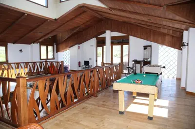 a room with a pool table on a balcony at Casa Genes Chera in Chera