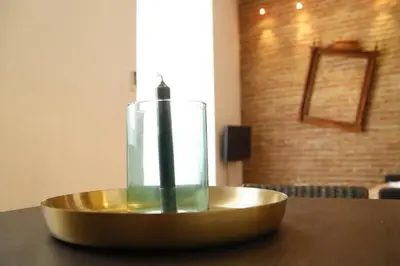 a candle in a bowl on a table at Precioso apartamento en el centro histórico in Valencia