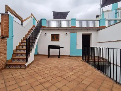 a room with a staircase and a piano in a house at Casa Rural Los Pequeños (Monserrat) in Monserrat