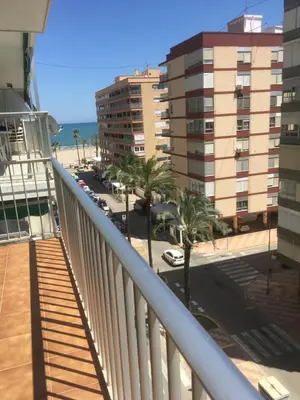 a balcony with a view of the beach and buildings at MAGNO CULLERA- Playa in Cullera
