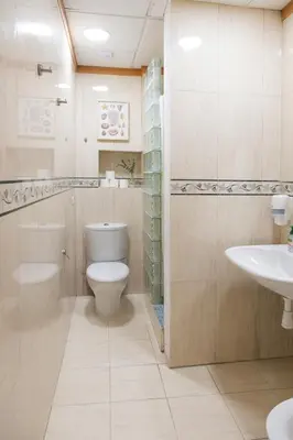 a bathroom with a toilet and a sink at Mercat Silence in Valencia