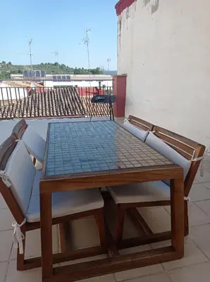 a table and chairs sitting on top of a roof at CA PEPICA in Anna
